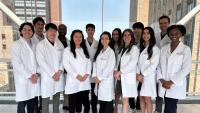 Group photo of medical residents in white coats